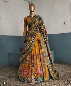 lehenga set  |womens kalamkari lehenga choli |crop top lehenga set |designer kalamkari lehenga dupatta | cream green wedding lehenga choli | mehendi hand painted kalamkari lehenga usa Women's lehenga set /kalamkari embroidered bluelehenga skirt/voggish      lehengas are one of the beautiful and versatile traditional attires of india !! we carry such pieces in budget with great quality that can be styled in multiple ways with different outfits !!       Here is Beautiful lehenga set in mustard yel Luxury Kalamkari Print Sets For Puja, Luxury Traditional Kalamkari Print Sets, Yellow Anarkali Set With Kalamkari Print, Floor-length Kalamkari Print Dupatta, Floor-length Kalamkari Dupatta For Diwali, Bohemian Dola Silk Choli For Wedding, Bohemian Dola Silk Lehenga For Weddings, Floor-length Kalamkari Anarkali Set For Wedding, Fitted Anarkali Dress With Tilla Details