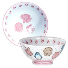 two bowls with animals painted on them and one bowl has an animal design in the center