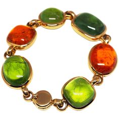 Thomas Leyser is renowned for his contemporary jewellery designs utilizing fine gemstones. This 18k rose gold (72.95g) bracelet is set with 6x fine Mandarin Garnet (57.74ct), Green Tourmaline (25.97ct) and Peridot (68.34ct) cabochons. Vintage Cuff Bracelet, Peridot Bracelet, Contemporary Jewelry Design, 18k Gold Bracelet, Modern Bracelets, Gems Bracelet, Tourmaline Bracelet, Garnet Bracelet, Garnet Jewelry