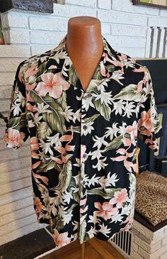 Retro men's Cotton Tropical Print on black with green and peach floral! Coconut buttons, one chest pocket. 19" across shoulders 10" sleeves 24" across chest 28" shirt Length Great condition "Bishop St" Size L Black Tropical Print Shirt For Spring, Black Floral Print Camp Shirt With Camp Collar, Black Shirt With Tropical Print For Spring, Black Floral Print Camp Shirt For Spring, Black Hawaiian Shirt For Spring, Hawaiian Shorts, New Retro, Retro Men, Mens Oxfords