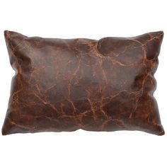 a brown leather pillow on a white background