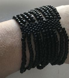 Very nice Ten strands of tiny black beads on elastic to firm cuff bracelet. Stretches up to seven inch wrist. Tight elastic. Victorian or goth style. Adjustable Black Stretch Bracelet With Spacer Beads, Black Beaded Stretch Bracelet For Party, Handmade Adjustable Black Stretch Bracelet, Adjustable Handmade Black Stretch Bracelet, Gothic Bracelet, Victorian Goth, Goth Style, Jan 17, Glass Beaded Bracelets