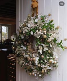 a wreath hanging on the side of a door