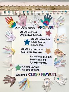 a sign with handprints on it that says, our class family promise we will use kind words and actions