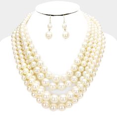 5 Strand Ivory Pearl (faux) Necklace & Earring Set by coreItem: Faux Pearl NecklaceBrand: coreColor: Ivory, GoldNecklace Length: 18" + 3" ExtensionEarring Length: 1.75" (inches)Earring Fastening: Fish HookDecor Size: 3" (inches)Necklace Fastening: Lobster Clasp Metal: Gold tone hardwareMaterials: Alloy, Faux PearlsTheme: Bridal, Prom, Pageant, Evening Necklace is comprised of dozens of simulated graduating faux pearls on 5 strands. All Measurements are Approximate Sold As One Individual Neck Chunky Pearl Necklace, Evening Necklace, Pearl Necklace Set, Pearl Cream, Fashion Jewelry Sets, Ivory Pearl, Pearl Set, Faux Pearl Necklace, Necklace Size