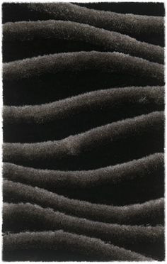 a black and white rug with wavy lines