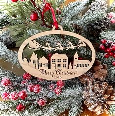 a wooden ornament hanging from a christmas tree