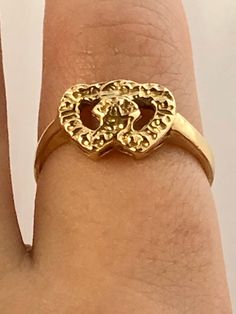 "Vintage 10k solid yellow gold interlocking open hearts ring! This ring is approximately a size 4.5. It measures approximately 5/16\" tall by 7/16\" wide at the head. It is unsigned (possibly handmade, vintage) but has been jeweler-tested and is guaranteed 10k solid gold. Sizing is available for this item. Please message me before checkout for sizing estimates. Item will arrive in gift packaging. Please see pictures, ask questions, and check out my other unique vintage jewelry treasures!" Hallmarked Gold Heart Ring For Anniversary, Gold Double Heart Ring For Valentine's Day, Gold Heirloom Heart Ring For Valentine's Day, Valentine's Day Gold Double Heart Ring, Gold Double Heart Ring In 14k, Gold Heart Ring Stamped 14k For Valentine's Day, Double Heart 14k Gold Ring, Vintage Gold Heart Ring For Valentine's Day, Gold Heart Promise Ring Certified