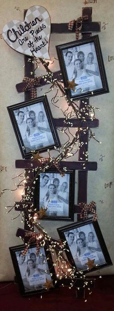 the family tree is decorated with pictures and lights on it's branches, which are adorned with ribbons