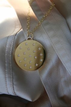 Our Diamond 'Lucky Stars' Classic Locket is adorned with 18 stunning diamond pavé stars. The perfect vessel to carry your precious memories and shine from the inside out. *In Judaism, 18 is the number for "chai", the Hebrew word for life. Giving in multiples of 18 symbolizes giving the gift of "life" or luck. It is one of the inspirations for our Lucky Stars Collection which features 18 diamond stars. Star Locket, Round Locket Necklace, Ring Bracelet Chain, Round Locket, Oval Locket, Locket Charms, Precious Memories, Birthstone Gifts, Lucky Star