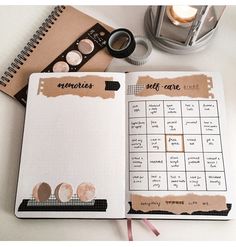 an open planner book sitting on top of a table