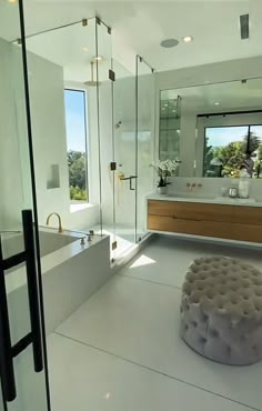 a large bathroom with an ottoman in the middle