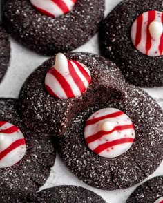 chocolate cookies decorated with white and red candy canes