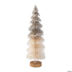 a small white christmas tree on a wooden stand