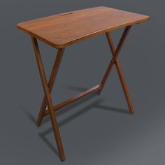 a small wooden table on a grey background