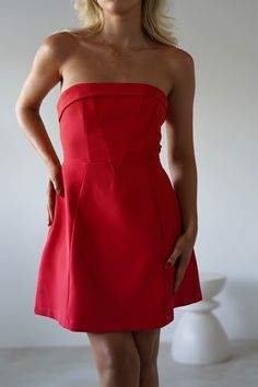 Highlights Gorgeous structured strapless mini Fully Lined Available in Red & Pink Sizing The model is 5'5 and wears UK size 8 / S / US size 4 Fit & Fabric Made from 100% Polyester Bust is lined with non slip latex Rear zip True to size Length from top of bust to hem: 61cm Stretch: 6/10 Perfect for Wedding Guest Graduations Parties Elegant Red Stretch Strapless Dress, Fitted Strapless Dress For Red Carpet, Fitted Strapless Sleeveless Dress For Red Carpet, Red Stretch Strapless Dress For Evening, Elegant Red Sleeveless Tube Top, Chic Red Mini-length Corset Dress, Chic Red Mini Corset Dress, Strapless Summer Dress For Red Carpet, Red Strapless Corset Dress For Formal Occasions