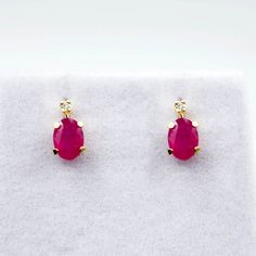 14K Yellow Gold Earrings Genuine Ruby 1.1ct Size of stone: 6x4mm With Diamond 0.02ct Size of earrings: Length: 0.32″, Width: 0.15″ Made in Canada Ruby in this product is naturally enhanced. * Comes with 14K gold silicon clutches for cushioned comfort and loss prevention * Ruby is the birthstone for July and known as the stone of Passion * This item is available in several gemstone selections. Please message me if you need any further information. * Pendant matching with this item is available. * Gold Ruby Earrings, Pierced, Red Ruby Single Earring, Yellow Gold Ruby Earrings With Brilliant Cut, Luxury Ruby Birthstone Earrings, Red Ruby Round Diamond Earrings, Ruby Stud Earrings, Ruby Earrings Studs, Womens Earrings Studs, July Birthstone Jewelry