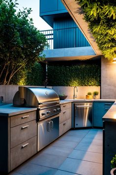 Modern outdoor kitchen with stainless steel appliances, ample counter space, and lush greenery. Grill Stations, Small Grill, Kitchen Styles