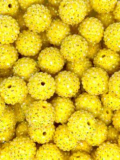 many yellow beads with small white dots on them