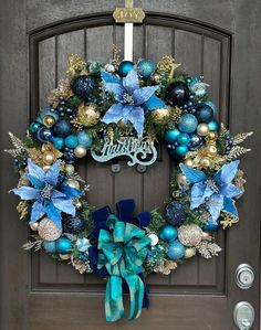 a christmas wreath with blue and gold decorations