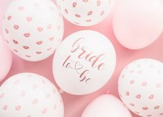 white balloons with pink confetti and the words bride to be written on them