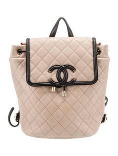 Chanel BackpackFrom the 2019 Collection by Karl LagerfeldBlack & NeutralsInterlocking CC Logo, Quilted Pattern & Chain-Link AccentGold-Tone HardwareLeather TrimFlat Handle & Dual Adjustable Shoulder StrapsLeather Trim Embellishment & Single Exterior PocketLeather Lining & Single Interior PocketSnap Closure at Front & Drawstring Closure at TopIncludes Dust Bag & Authenticity Card Luxury Beige Backpack, Elegant Backpack With Branded Hardware, Perfect Purse, Quilted Pattern, Designer Gifts, Bag Handle, Cc Logo, Chanel Shoes, Handbag Backpack