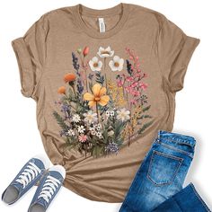 Style: Add some style to your wardrobe with our custom-designed tees! These graphic tees for women are the perfect blend of style and comfort and are sure to add some fun and fashion to your attire. Quality: Our women's tops are designed and printed with love in the USA. We use high-quality inks on premium Bella Canvas unisex fall shirts for women for a bold and stylish look. Fabric: Crafted with a premium blend of 100% Airlume combed and ring-spun cotton, our unisex shirts for women are incredibly soft, lightweight, and breathable.  Perfect Fit: Our t shirts for women come in a variety of sizes so you can find the perfect fit! Our women's shirts come in sizes from XS - 4XL so everyone in the family can join in the fun! We do not pre-tie or roll our shirts. We leave that up to your style. Floral Pattern Shirt, Womens Boho Tops, Vintage Graphic Tees, Floral Cottagecore, Botanical Shirt, Graphic Tank Tops, Graphic Tees Vintage, Womens Crewneck, Vintage Graphic