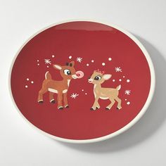 a red plate with two little deer on it