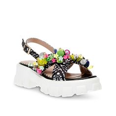 Betsey Johnson-Selah Platform Sandal The Selah platform sandal from Betsey Johnson lends an eye-catching look to your style. Crisscross straps with floral and fruit embellishments and attractive prints highlight this slingback sandal designed with a lightly cushioned footbed for optimal comfort.