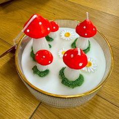 a cake with mushrooms and daisies on it