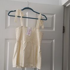 Cream Eyelet Tank With Tie Straps, Smocked Top. Never Worn. New With Tags. Beige Smocked Top For Summer Day Out, Beige Smocked Top For Day Out, Summer Smocked Cotton Top For Brunch, Summer Cotton Smocked Top For Brunch, Beige Top With Smocked Back For Day Out, Beige Tops With Smocked Back For Day Out, Summer Beige Tops With Smocked Bodice, Beige Cotton Top With Smocked Back, Casual Cream Smocked Top For Spring