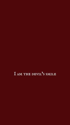 the words i am the devil's smile are in white on a red background