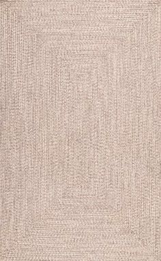 an area rug that is beige and has small squares in the middle, on top of it