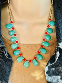 "The adorable Synthetic turquoise, red, and silver western beaded necklace is made with a cable chain and lobster claw connector. Made in the USA. This necklace is the perfect accessory for any women's wardrobe.  This necklace is a great gift for her.  The necklace is a length of 19\" - 21\"" Adjustable Turquoise Necklace With Colorful Beads, Handmade Red Turquoise Necklace For Jewelry Making, Southwestern Style Red Necklace For Festivals, Multicolor Adjustable Traditional Turquoise Necklace, Red Jewelry With Lobster Clasp For Festivals, Turquoise And Red Beaded Necklace, Red Bohemian Teardrop Necklace, Multi-strand Turquoise Necklace With Colorful Beads For Gifts, Red Bohemian Beaded Necklace With Lobster Clasp