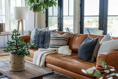 a living room filled with lots of furniture and decor on top of a wooden table