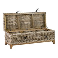 a wicker trunk with two doors and handles