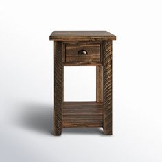 a small wooden table with one drawer