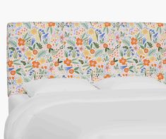 an upholstered headboard with colorful flowers on it