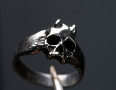 Skull ring Devil mini Material: Sterling Silver 925 Please note that actual colors may vary slightly from their appearance on screen. For more information, please visit my shop policies. If you have any questions, please do not hesitate to contact me. Delivery of the world Adjustable Skull Rings With Symbolic Style, Skull Shaped Sterling Silver Ring In White Gold, Halloween Skull Sterling Silver Jewelry, Skull Shaped Symbolic Jewelry Stamped 925, Symbolic Skull Shaped 925 Stamped Jewelry, Halloween Skull Ring As Gift, Halloween Skull Ring For Gift, Halloween Skull Rings As Gifts, Hand Cast Black Skull Ring