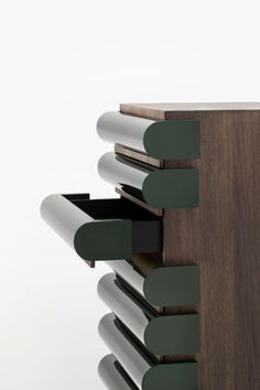 a close up of a wooden shelf with many drawers