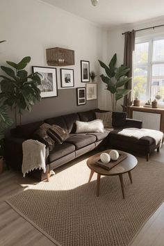 a living room filled with furniture and pictures on the wall