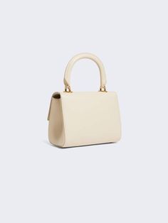 [vc_row][vc_column width=”1/3″][vc_column_text text_larger=”no”] Schiaparelli Schiaparelli Mini Secret Bag A bag crafted from smooth ecru lambskin. It is secured with a High-end Cream Shoulder Bag For Evening, Luxury Cream Satchel With Top Handle, Beige Handheld Satchel For Evening, Luxury Cream Top Handle Satchel, Designer Satchel With Adjustable Handle For Formal Occasions, Elegant Leather Shoulder Bag With Pearl Handle, Designer Formal Satchel With Adjustable Handle, Timeless Evening Bag With Gold-tone Hardware, High-end Cream Top Handle Bag