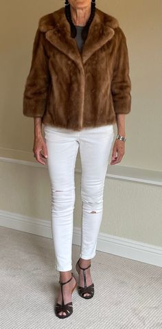 This is a short vintage tan or Autumn Haze mink fur jacket from the 1960s or 1970s. This beautiful mink fur jacket is perfectly clean and in wonderful condition. The tan or beige mink fur found on this coat is silky soft with little wear, no holes, and no odors. This short modern mink fur has two lined pockets and lovely mink fur lapels. This vintage fur jacket is fully lined in a clean satin fabric with a personalized name on a fabric label that can easily be removed if you wish to remove it. Perhaps a size S will wear this fabulous vintage mink fur jacket best. The bust is 40 inches, the waist is 44 inches, and the length is 22 inches. Fitted Mink-colored Fur Coat For Spring, Vintage Fur Jacket, Mink Jacket, Fabric Labels, Vintage Short, Vintage Fur, Mink Fur, Vintage Shorts, Jacket Coat