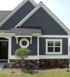 a house with blue siding and white trim