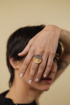 Disc Ring Gold-plated Sterling Silver, Adjustable Labyrinth Ring, Gold and Silver Circle Ring Women, Ethnic Ring Adjustable This dainty ring puts the traditional filigree technique face to face with a reinterpretation of this ancestral jewelry procedure.  The ring is made in sterling silver and is available in six different versions. Please select which one you would like during the purchase: 1) Silver - the entire ring is in sterling silver 2) Gold - 24 Kt gold-plated sterling silver 3) Black - Rhodium-plated sterling silver 4) Gold + Silver - Half gold-plated + half silver 5) Black + Silver - Half rhodium-plated + half silver  6) Gold + Silver Lines - 24 Kt Gold-plated sterling silver with two lines in silver  Measurements:  - ring: 2mm thick ;  - disc: 24 x 24 x 1 mm;  Finishes: polishe Disc Ring, Silver Cloud, Modern Engagement Rings, Silver Circle, Silver Bow, Circle Ring, Face To Face, 24kt Gold, Ring Women