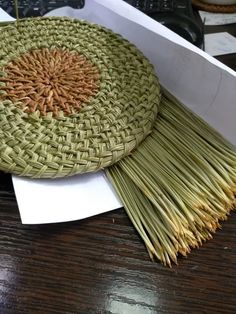 a basket sitting on top of a wooden table next to a computer keyboard and mouse