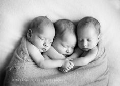 three newborn babies sleeping together on a blanket in black and white photo with text overlay