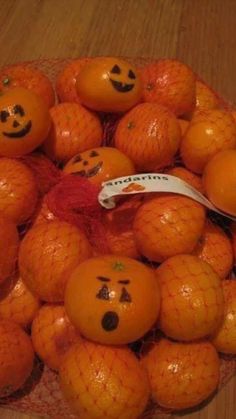 an image of oranges with faces drawn on them and the caption says cute idea always looking for party ideas that don't involve candy draw jack - lantern faces