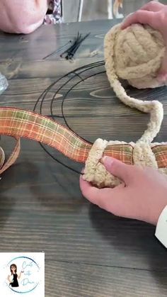 someone is making something out of fabric on a table