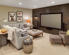 a living room filled with furniture and a flat screen tv mounted to the side of a wall